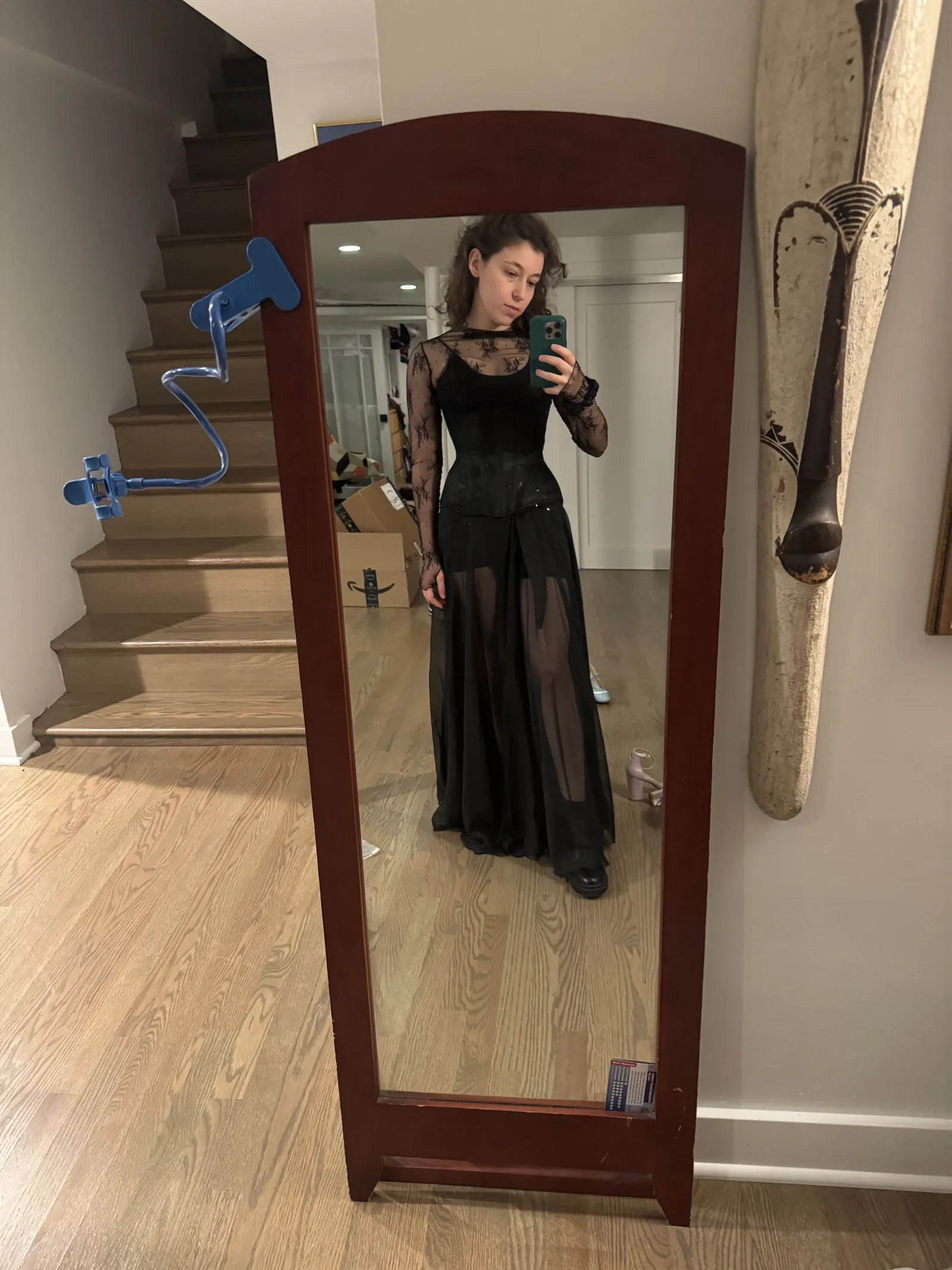 Full-length mirror selfie wearing a black lace top and a long sheer skirt.
