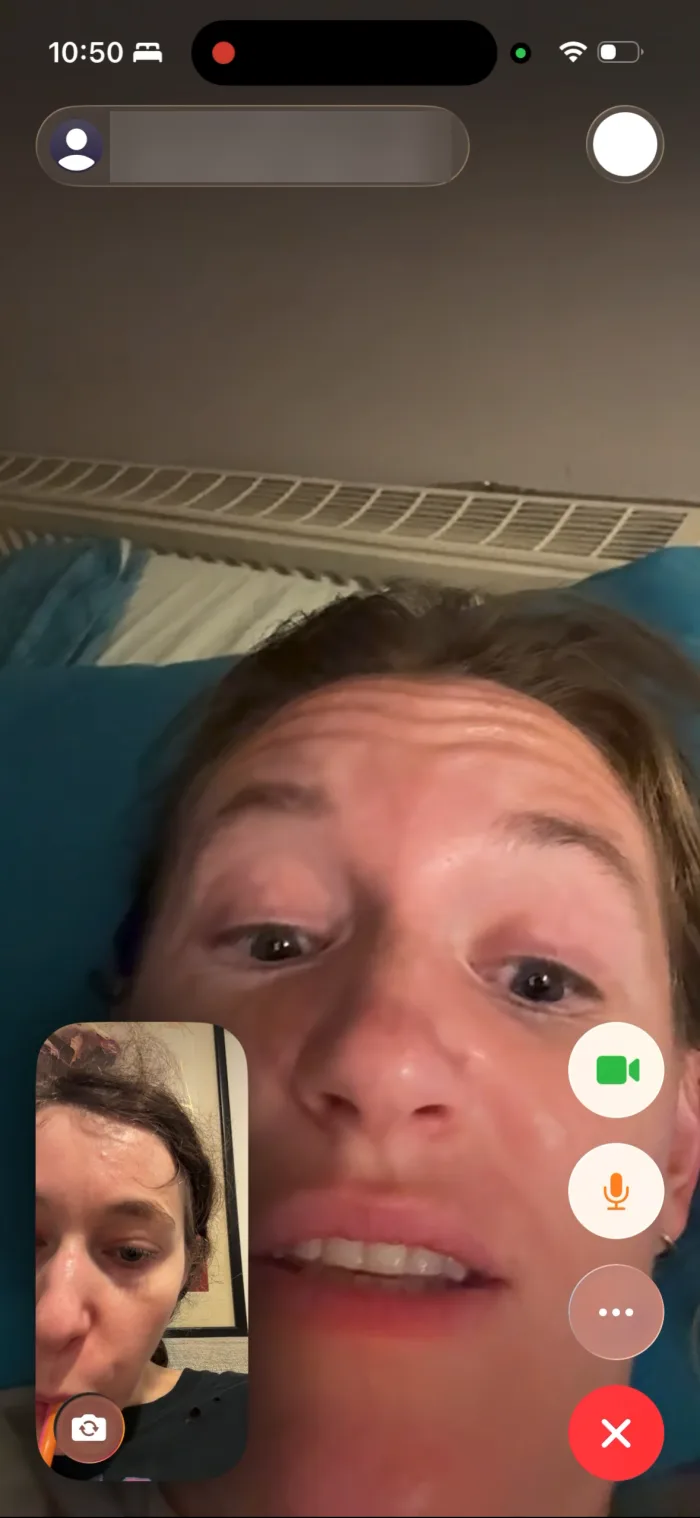 Dr. Karen Konkoly on a FaceTime call, lying in bed and talking, with Dashiell in the small inset.