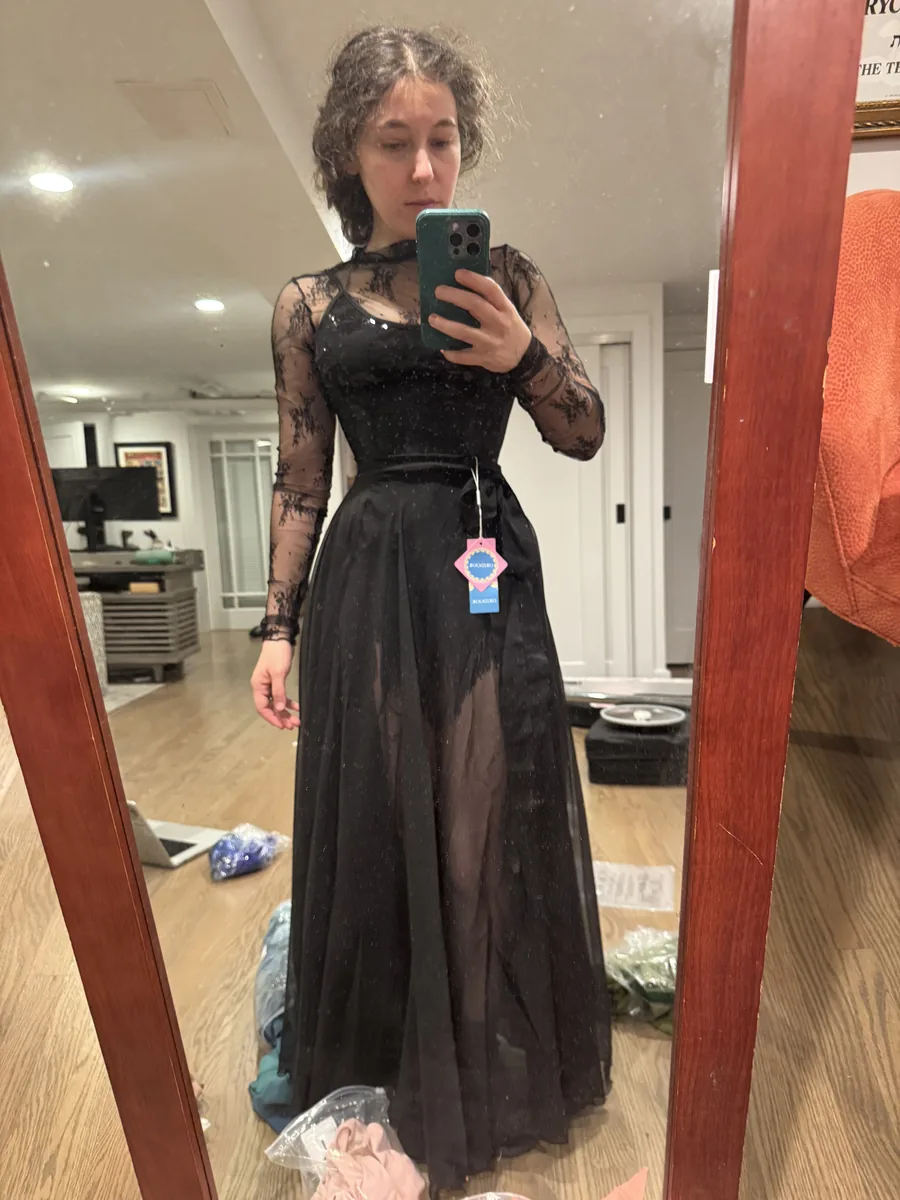 Try-on photo of a black outfit with the skirt layered differently