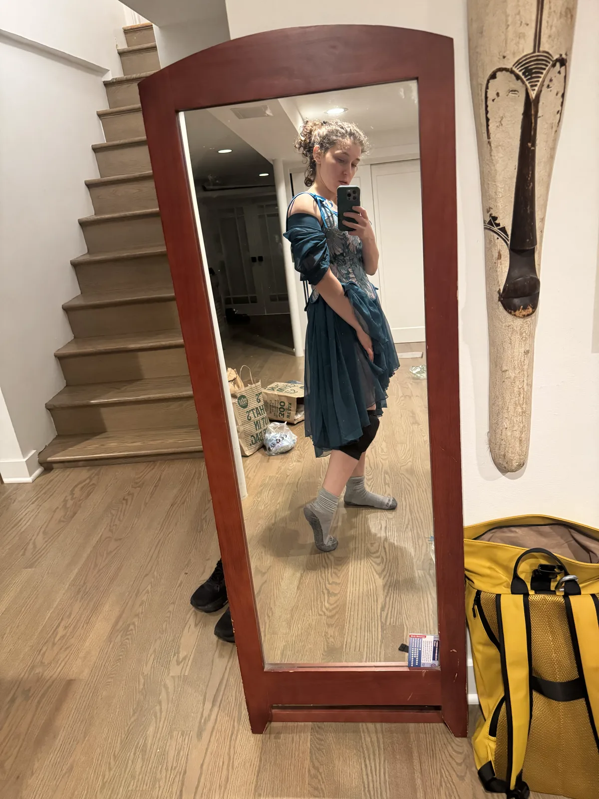Full-length side-view mirror selfie of a blue corset and layered dark teal skirt.